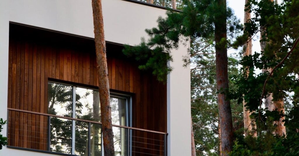 A stylish wooden house with large windows set amidst tall pine trees, ideal for nature lovers.